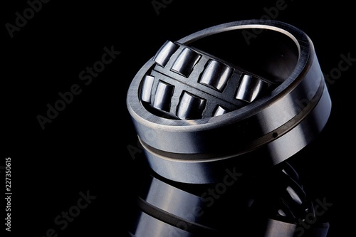 Close-up of a set of ball and roller bearings on a dark background