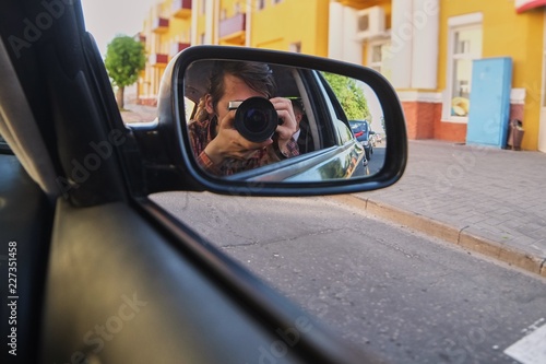 Selfie on the camera in the car mirror © Vitaly