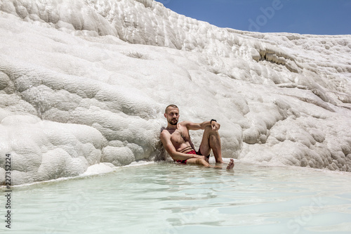 Man posing near the thermal springs and travertines of Pamukkale © toshket