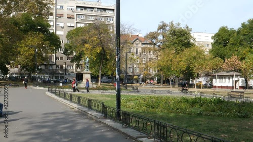 People at Studentski Park (Academic Park) famous park in Studentski Trg (Students Square) Belgrade City Center with statues of important Serbian academic People. Belgrade 21 October 2017 photo