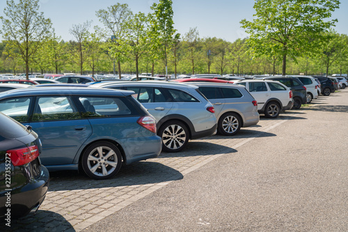 row of cars in parking lot