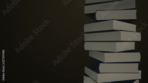 Animation rotation of stack of old books in library or home with flying letters. Books with leather covers and golden stripes. Animation of seamless loop. photo