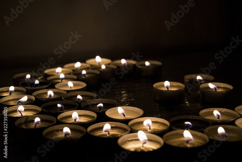 Symbols of Islam. Candle lights on black background. Abstract isolated photo