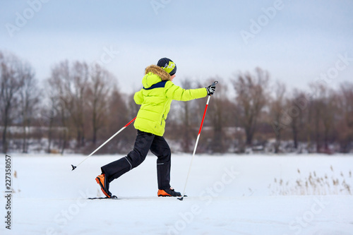 Cute little boy having fun during skiing on cross