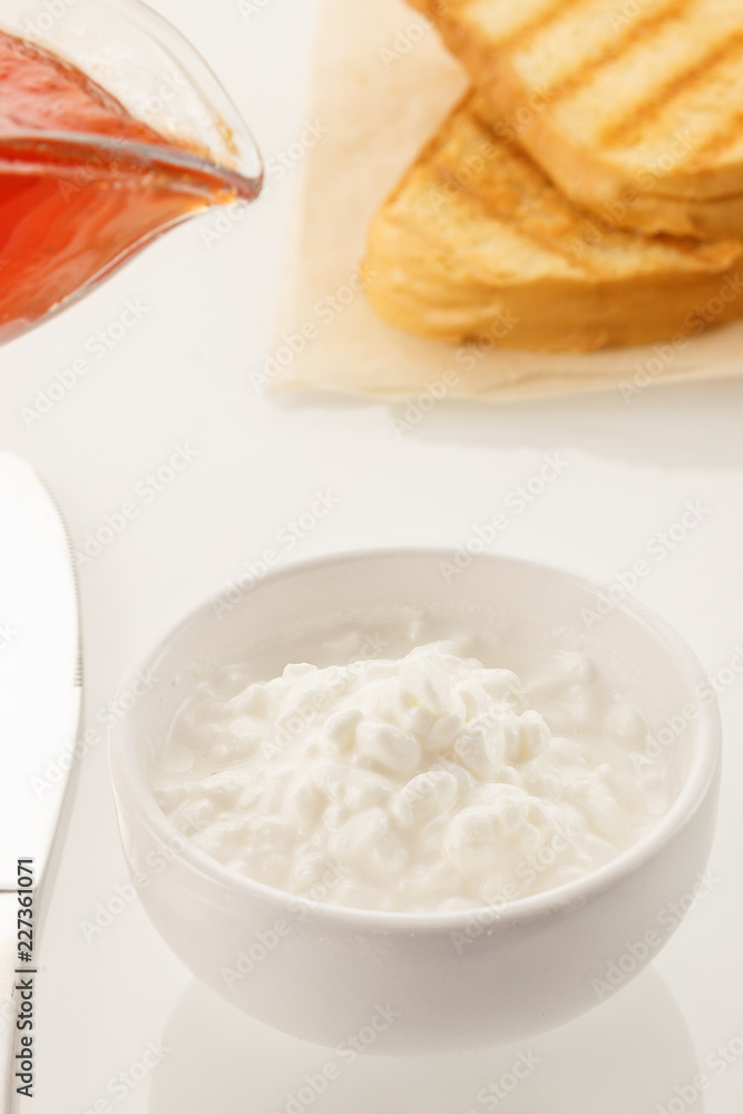 Healthy food. Morning breakfast. Healthy diet and breakfast. Cheese jam and bakery. Closeup white background Top view
