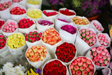 Several bouquets of carnation ready for sale in a street flower market