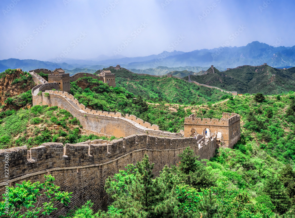 The Great Wall Jinshanling section with green trees in a sunny day, Beijing, China