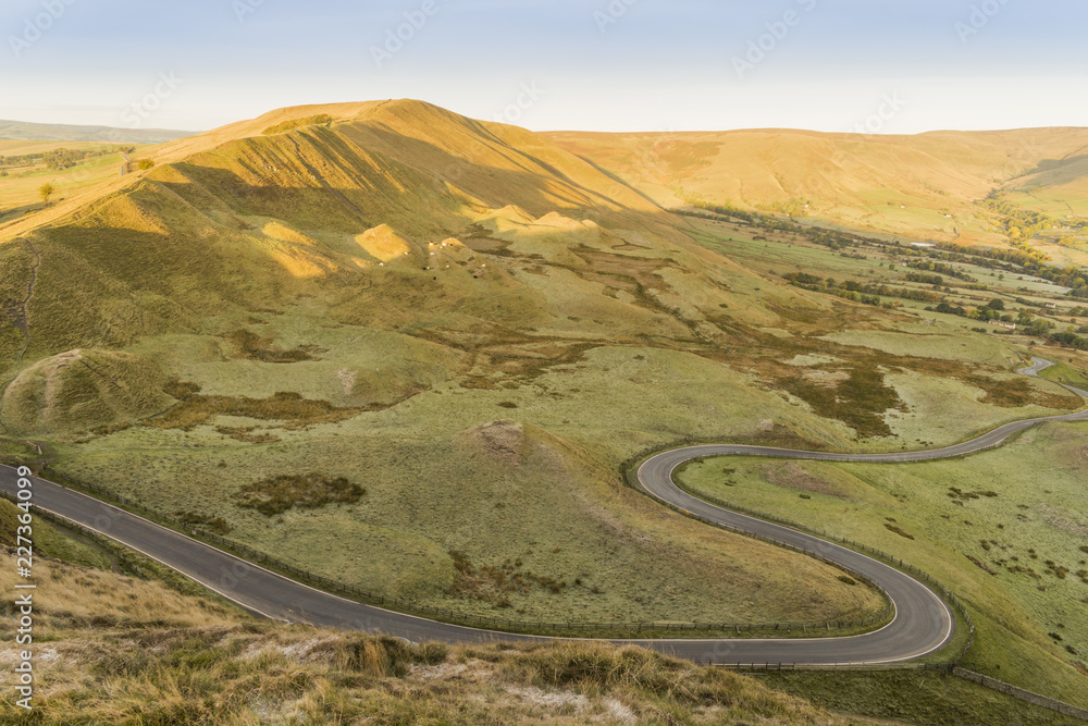 Mountain and a twisty road in the morning at Peak District