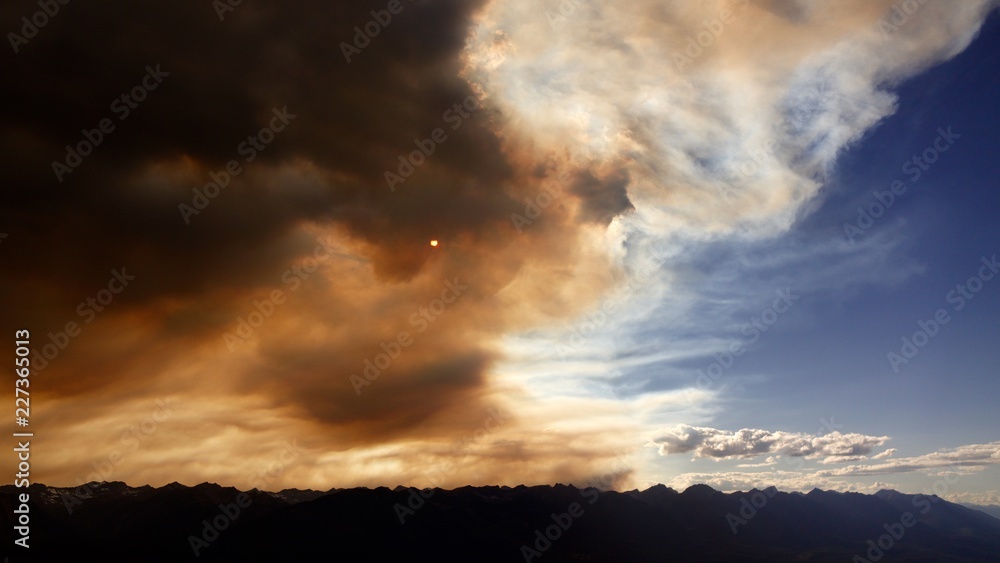 Wildfire smoke meets blue sky.