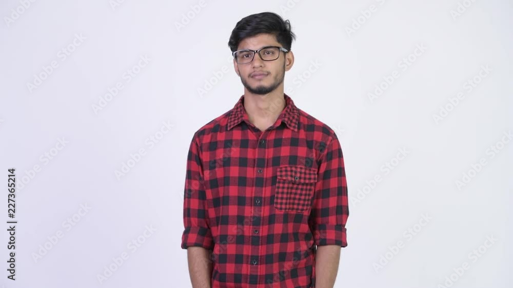 Young handsome bearded Indian hipster man thinking Young handsome bearded Indian hipster man thinking