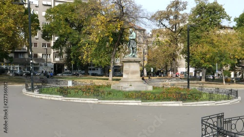 People at Studentski Park (Academic Park) famous park in Studentski Trg (Students Square) Belgrade City Center with statues of important Serbian academic People. Belgrade 21 October 2017 photo