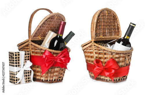Set with gift baskets and wine on white background