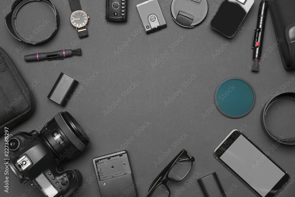 Flat lay composition with equipment for professional photographer on dark background. Space for text Flat lay composition with equipment for professional photographer on dark background. Space for text