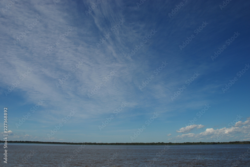 Big skies above the River Amazon and rainforest, Brazil