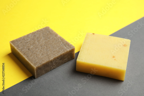 Hand made soap bars on color background