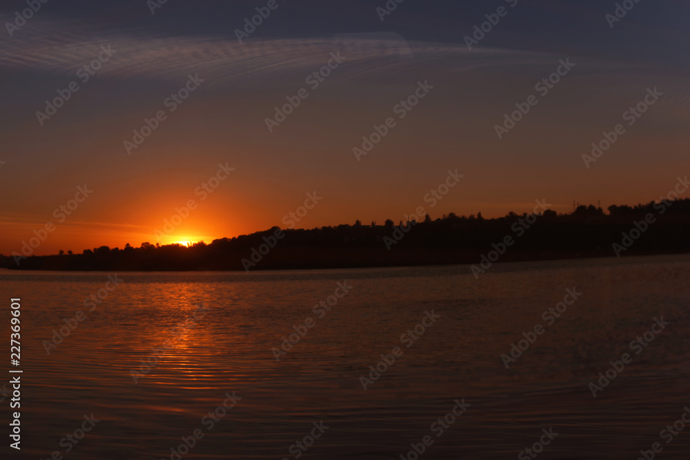 Picturesque view of beautiful sunset on riverside Picturesque view of beautiful sunset on riverside