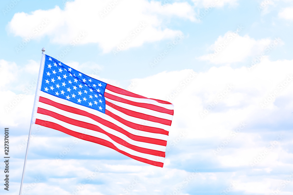 Naklejka premium Woman with American flag outdoors on cloudy day. Space for text