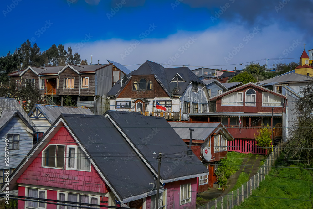Above view of rooftop of colorful houses in the horizont located in Castro, Chiloe Island