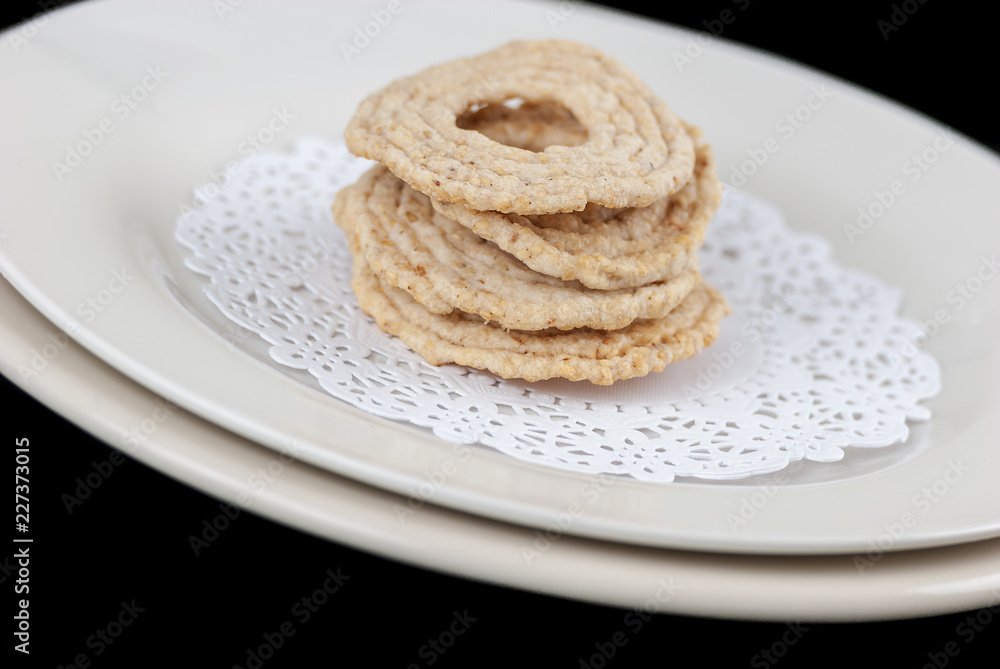 stacked ethnic treats on a plate stacked ethnic treats on a plate