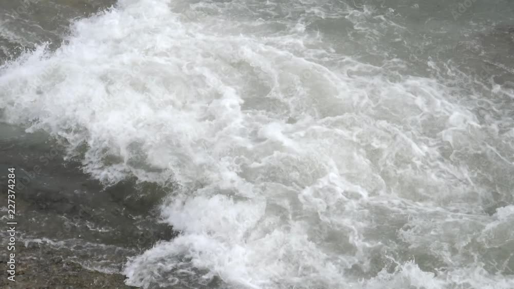 City river with rapids. Strong current. Summer day City river with rapids. Strong current. Summer day