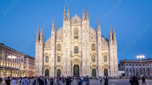 The Milan Cathedral (Duomo di Milano), one of the most important landmarks of the city. Day to night video. Illumination switch on. Timelapse. photo