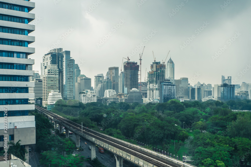 Building in the city with Electric Railway Train in Bangkok Thailand