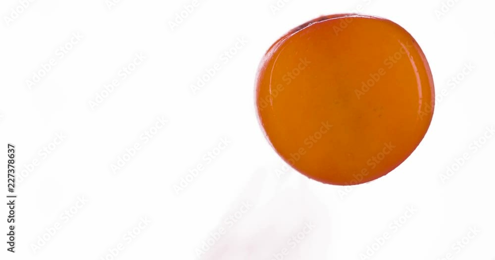 Crush the Ripe Sea Buckthorn Berry. Wild sea buckthorn berries are compressed and crushed close-up on a bright white background, creating a juicy burst of pulp and shell. Shooting at 120fps Crush the Ripe Sea Buckthorn Berry. Wild sea buckthorn berries are compressed and crushed close-up on a bright white background, creating a juicy burst of pulp and shell. Shooting at 120fps