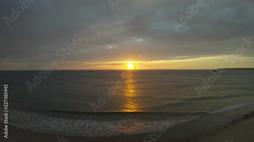 Aerial Drone 4k footage of sunset along La Braye Beach, Jersey. photo