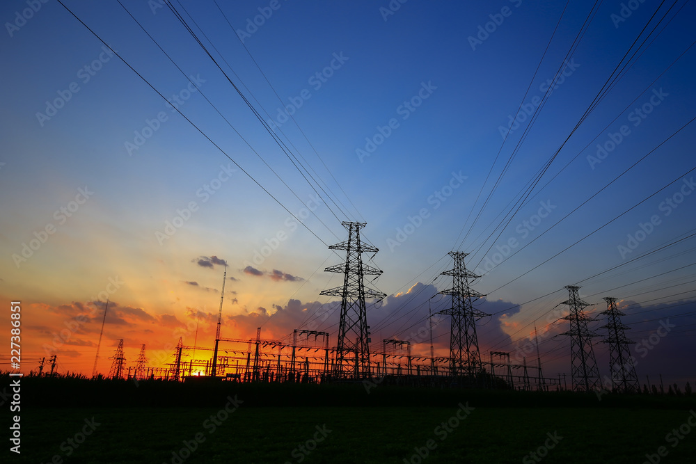 Fototapeta premium Electric tower, silhouette at sunset