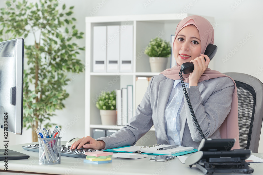 Muslim operator in office suit answering the phone call Stock Photo ...