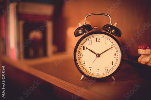 alarm clock on shelf