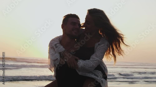 Beautiful woman piggybacking on her boyfriend