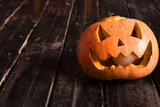 on the wooden floor pumpkin as a symbol of Halloween