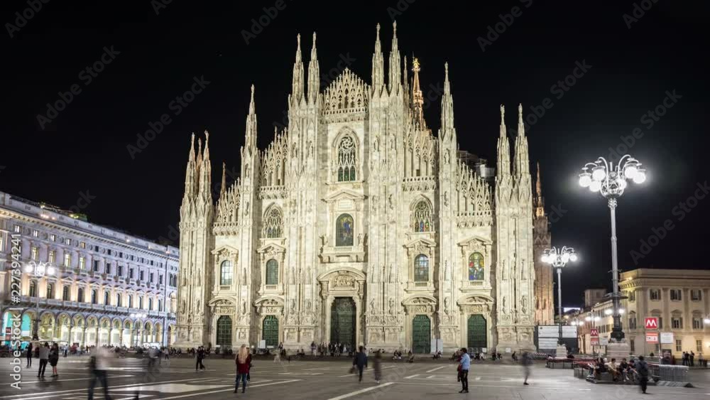The Milan Cathedral (Duomo di Milano), one of the most famous landmarks of Milan. Italian Gothic architecture. Night, timelapse video. The Milan Cathedral (Duomo di Milano), one of the most famous landmarks of Milan. Italian Gothic architecture. Night, timelapse video.