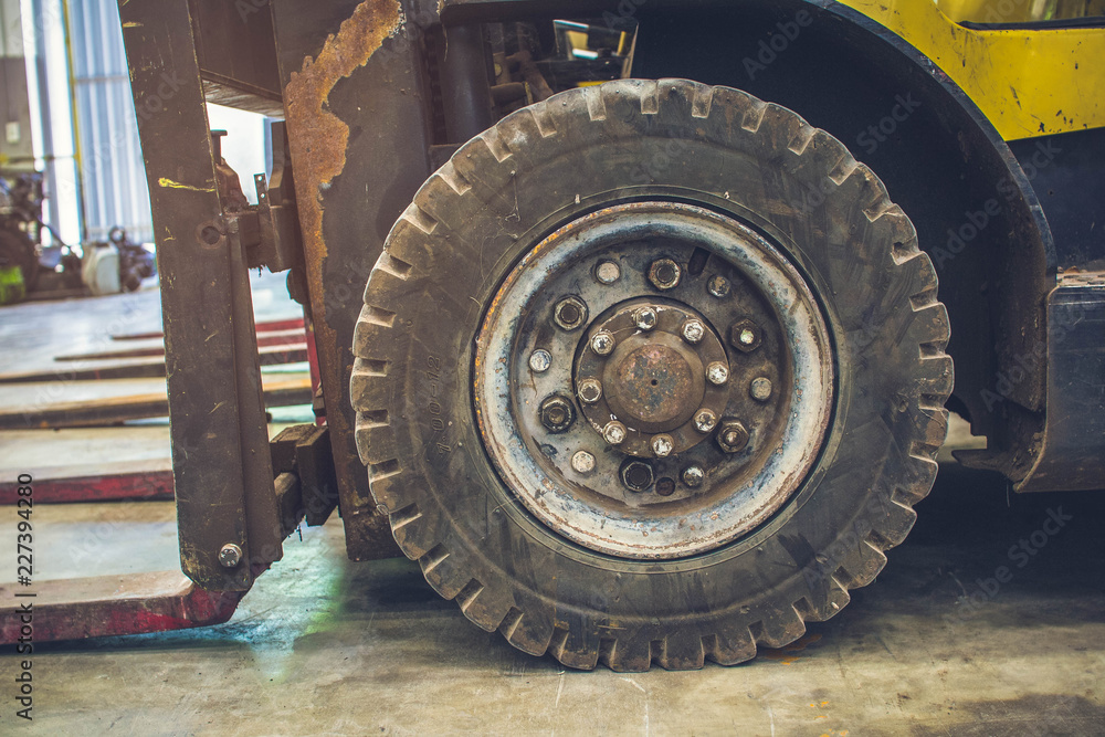 The front wheels of the forklift. The front wheels of the forklift.
