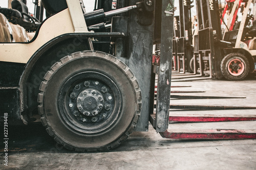 The front wheels of the forklift.