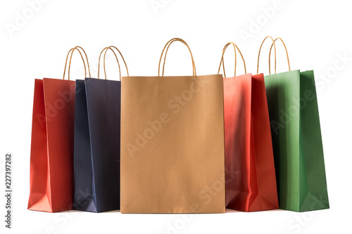 Colourful paper shopping bags on white background