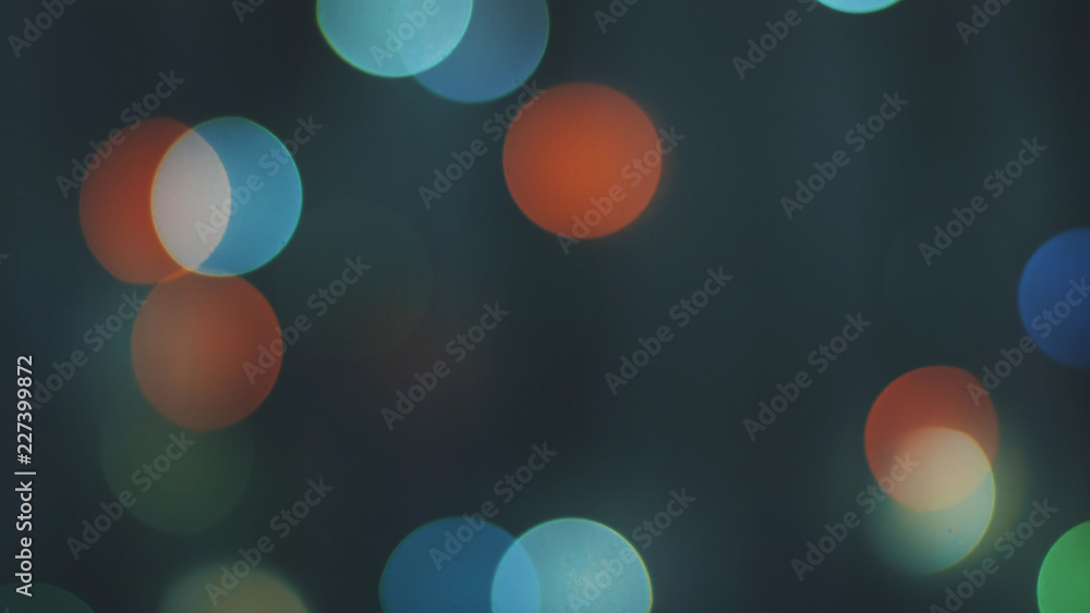 Colorful sparkling bokeh and flashing new year lights in soft focus. Abstract sparkling