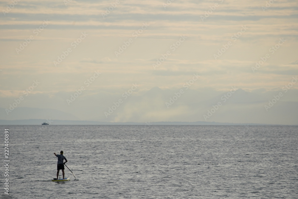 man on a paddle board in the sea