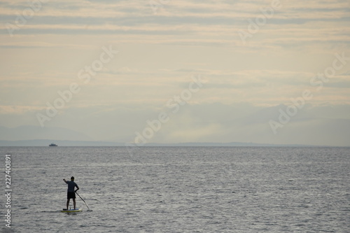 man on a paddle board in the sea