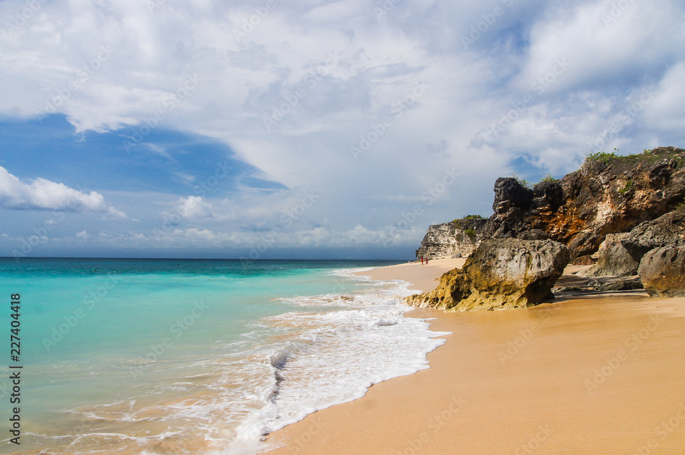 Beautiful  Dreamland Beach Bali, with clean sand and rocks.
