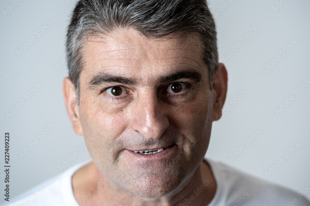 Obraz premium Mad and aggressive guy in facial expressions and human emotions