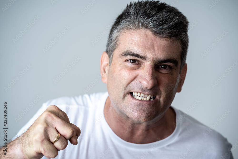 Mad and aggressive guy in facial expressions and human emotions Mad and aggressive guy in facial expressions and human emotions