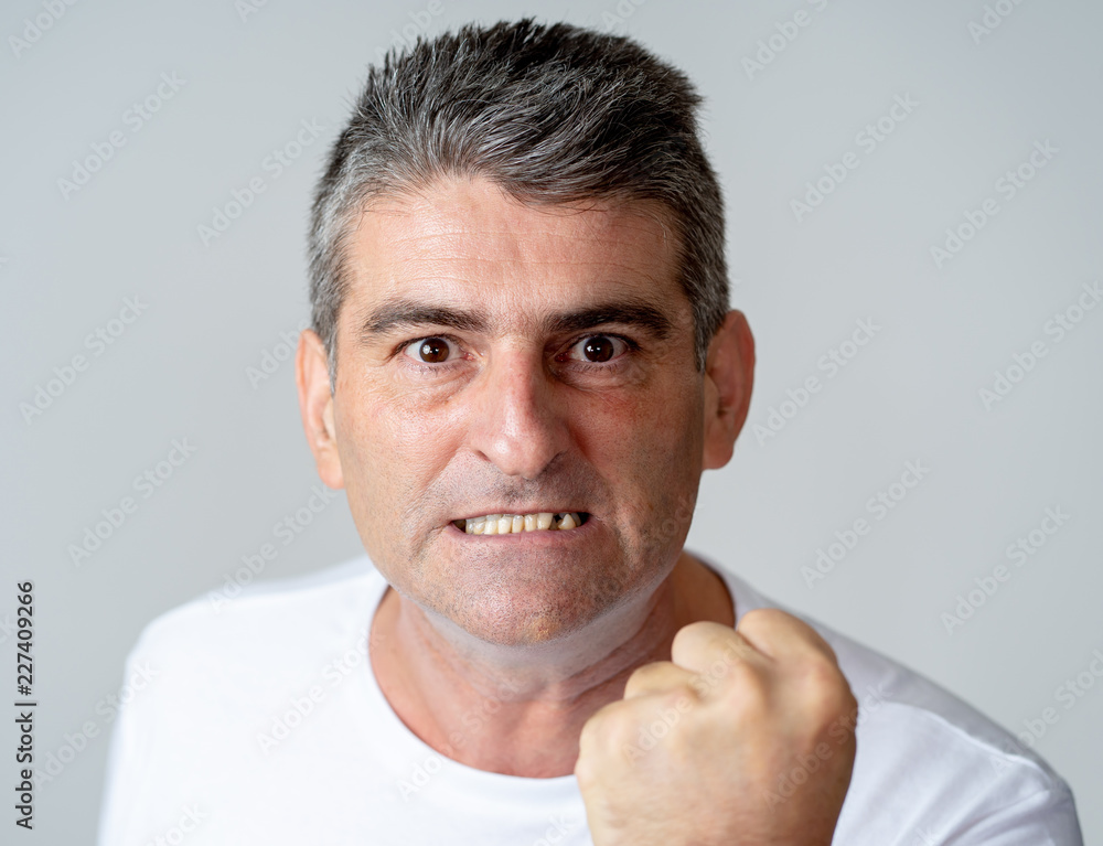 Fototapeta premium Mad and aggressive guy in facial expressions and human emotions