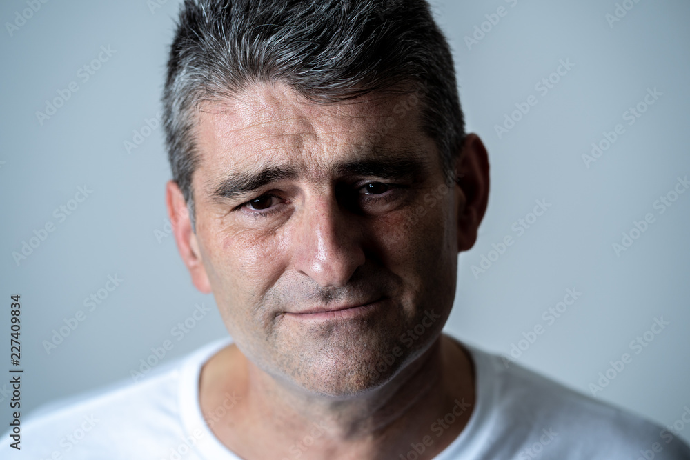 Sad and desperate mature handsome man feeling depressed in Facial expressions and depression Sad and desperate mature handsome man feeling depressed in Facial expressions and depression