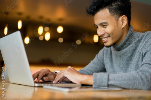 close up freelance man working on laptop at cafe , lifestyle concept photo