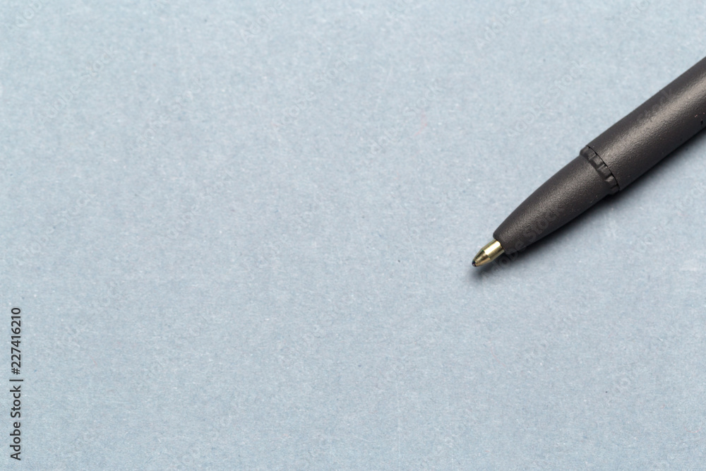 Ballpoint pen showing communication contact us or mail concept on gray background Ballpoint pen showing communication contact us or mail concept on gray background