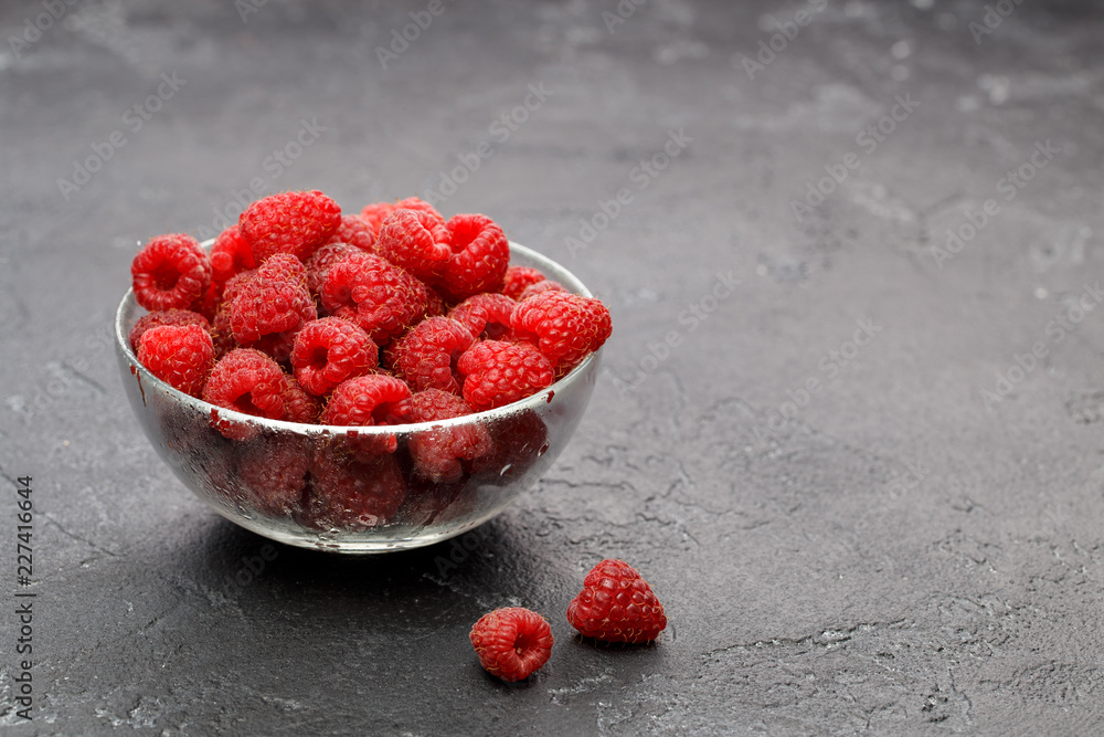 Photo of raspberries in transparent glass cup Photo of raspberries in transparent glass cup
