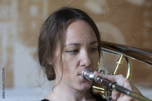 Teenage girl playing the trombone