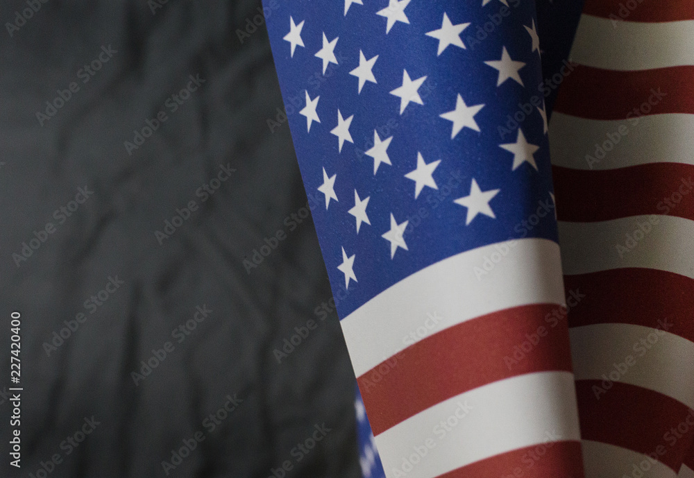 Obraz premium The Veterans Day concept united states of America flag on black background..